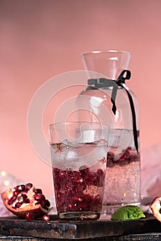 Pomegranate seeds in ice water