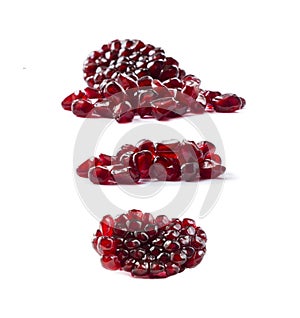 Pomegranate seeds isolated on white background. Ripe pomegranates close-up. Sweet and juicy garnet with copy space for text