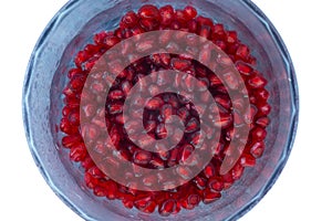 Pomegranate seeds on a light background