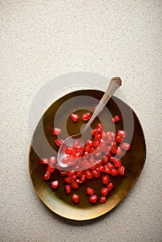 Pomegranate seeds in a metal tray