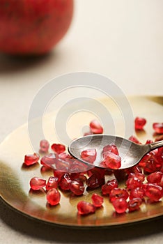 Pomegranate seeds in a metal tray