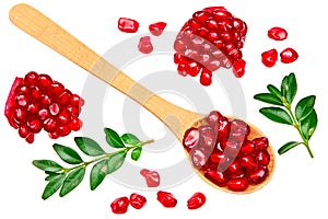 pomegranate seeds in wooden spoon isolated on white background. top view. pomegranate berries