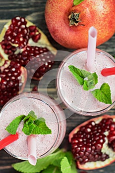 Pomegranate smoothie in glasses photo