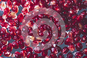 Pomegranate stones on the mirror surface photo