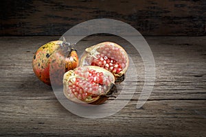 Pomegranate on wooden background.