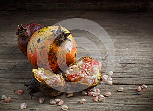 Pomegranate on wooden background.