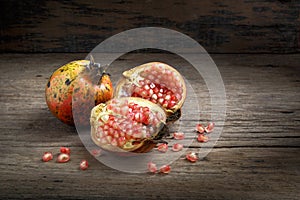 Pomegranate on wooden background.