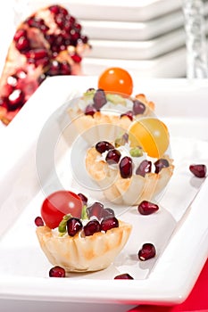 Pomegranates and cream cheese canapes