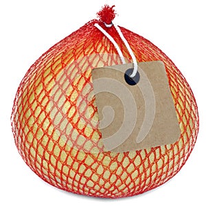 Pomelo Fruit In Netting Pack Isolated On White