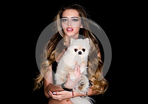 Pomeranian dog or puppy pet. Cute house dog with beauty woman. Woman with dog. Portrait of beautiful female model. High