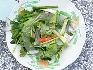 Pomfret Fish dish cooking with various ingredients. Fresh raw fish decorated with vegaetable. Steaming Fish Chinese Style