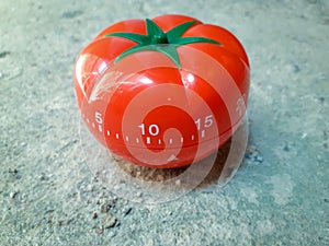 Pomodoro Timer in concrete floor white dirty old cement texture