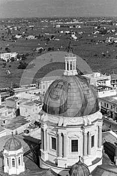 Pompeii, Italy, 1961 - Houses, countryside and farms form the backdrop to the dome of the sanctuary of the Madonna of Pompei