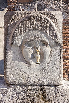 Pompeii in Naples, Italy. Ancient fontain, Roman city ruins