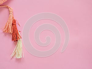 Pompoms on pink  with copy space