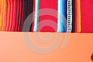 Poncho Mexican cinco de mayo rug serape fiesta traditional Mexico background with stripes copy space maya blanket minimal simple -