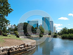 Pond in Ala Moana Beach Park with Condominiums towers across the