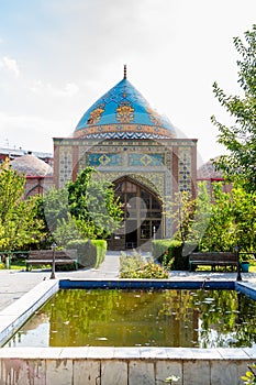 pond and Blue Mosque in green yard in Yerevan