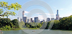 Pond in the central park in NYC. Central Park and Manhattan Skyline. Midtown Manhattan skyline viewed from Central Park