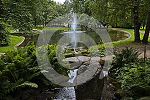 Pond with fountain in public park Slottsparken at the Royal Palace in Oslo, Norway photo