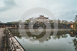 Pond in front of the Imperial Palace. Ancient Asian architecture. Historical sights of Vietnam