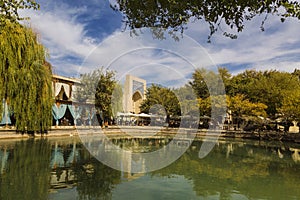 The pond house of Nadir-Run on the Central square Lyabi-Khauz with the khanaka divan-Begi in the background. Bukhara,