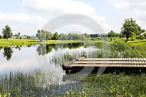 A pond with a small pier