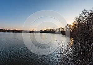 Pond with trees around in CHKO Poodri in Czech republic during springtime evening photo