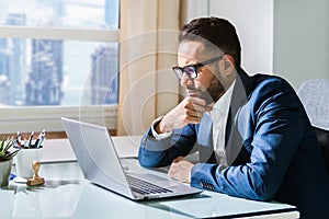 Pondering Thinking Businessman Using Office Computer