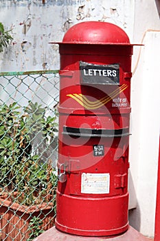 Red Post box outside the Post office in Pondicherry - Indian post office - communication through letters photo