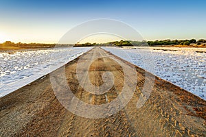 Ponds full of salt after evaporation of ocean water at salines in Faro, Portugal