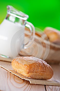 Pone bun, pitcher of milk photo
