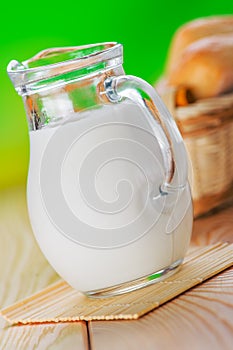 Pone bun, pitcher of milk photo