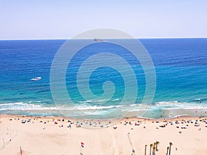 Poniente beach of Benidorm in summer seen from the heights with the beach, the sea and the island in the background