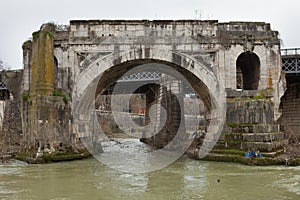 The Pons Aemilius Ponte Emilio or Ponte Rotto. Oldest Roman stone bridge in Rome, Italy photo