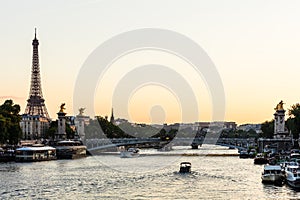 Pont Alexandre III Bridge and Eiffel Tower at sunset. Paris, France