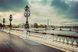 Pont Alexandre III bridge in Paris, France. Seine river and Eiffel Tower.