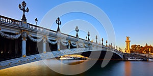 Pont Alexandre III bridge and Seine River at sunset panoramic. Paris, France