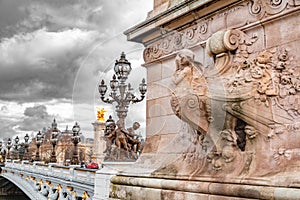 The Pont Alexandre III is a deck arch bridge that spans the Seine in Paris