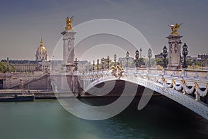 Pont Alexandre III and Invalides dome on Seine river, Paris, france