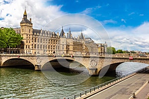 Pont au Change bridge over Seine river and Conciergerie palace and prison in Paris, France