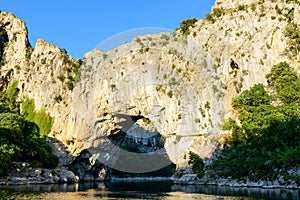 The Pont dArc in the Ardeche gorges in the middle of nature in Europe, France, Ardeche, in summer, on a sunny day