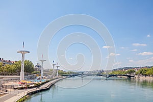 Pont de l`Universite bridge in Lyon, France over a panorama of the riverbank of the Rhone river Quais de Rhone