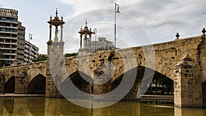 Pont de la mar, medieval bridge with towers and statues in Valencia, Spain photo