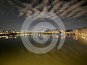 Pont des Catalans Spanning the Tranquil Garonne Under Night Clouds in Toulouse