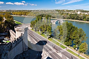 Pont du Avignon and city walls tower beside street and Rhone riv