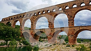 Pont du Gard - Panoramic view of ancient old Roman Aqueduct Pont du Gard ear Vers-Pon-du-Gard, Occitanie, France, Europe