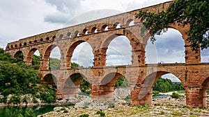 Pont du Gard - Panoramic view of ancient old Roman Aqueduct Pont du Gard ear Vers-Pon-du-Gard, Occitanie, France, Europe