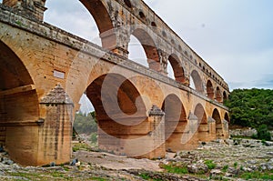 Pont du Gard - Panoramic view of ancient old Roman Aqueduct Pont du Gard ear Vers-Pon-du-Gard, Occitanie, France, Europe