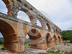 Pont du Gard - Panoramic view of ancient old Roman Aqueduct Pont du Gard ear Vers-Pon-du-Gard, Occitanie, France, Europe